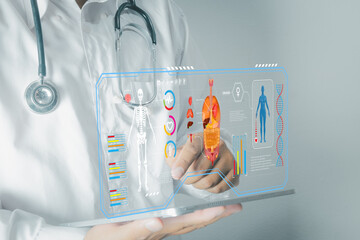 Doctor using tablet with futuristic virtual interface. Analyzing human anatomy, body scan, and patient data. Electronic Health Record (EHR) and healthcare technology concept.