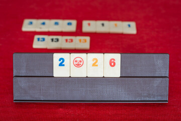 Playing classic family board game rummikub in year 2026