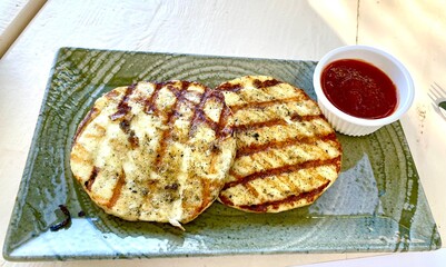 grilled greek cheese on a plate