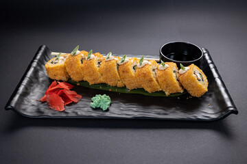 Japanese rolls, fish, black background