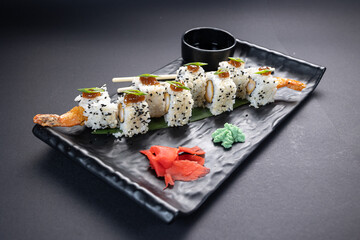 Japanese rolls, fish, black background