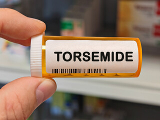 Box of TORSEMIDE tablets on a hospital pharmacy table used to reduce fluid retention a loop...