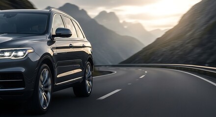 Dark suv driving on a winding road with mountains in the background during daytime conditions seen closely
