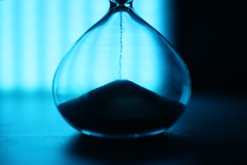 Hourglass as symbol of passing time concept photo	
