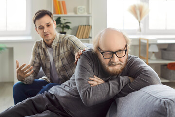 Senior man and his adult son having family conflict due to serious misunderstanding. Angry, mad...