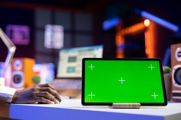 Close up of isolated screen tablet used by worker in home office analyzing data charts, identifying trends. Freelancer using chroma key device, compiling analytical reports, processing data
