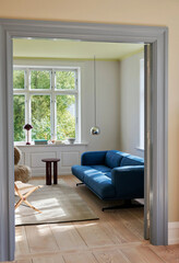 elegance blue sofa in modern apartment interior retro rustic style vertical photo