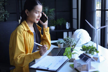 Beautiful engineer working in office design eco friendly and sustainable living home.