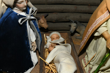 Baby Jesus laying in a cradle