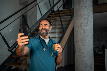 Doctor taking telehealth video call holding coffee