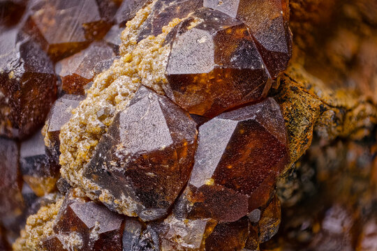 Garnet Crystals from Dalnegorsk, Russia. Red-Brown Faceted Structure, Macro Photography of Natural Mineral, Surface Textures, Collector&rsquo;s Specimen