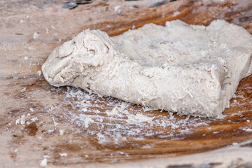 Poi or popoi is a traditional staple food in the Polynesian diet, made from taro.  Waiahole Poi Factory, Honolulu, Oahu, Hawaii. pounding taro / hand pound poi.