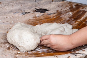 Poi or popoi is a traditional staple food in the Polynesian diet, made from taro.  Waiahole Poi Factory, Honolulu, Oahu, Hawaii. pounding taro / hand pound poi.