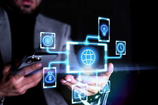 Businessperson holding glowing global business network hologram