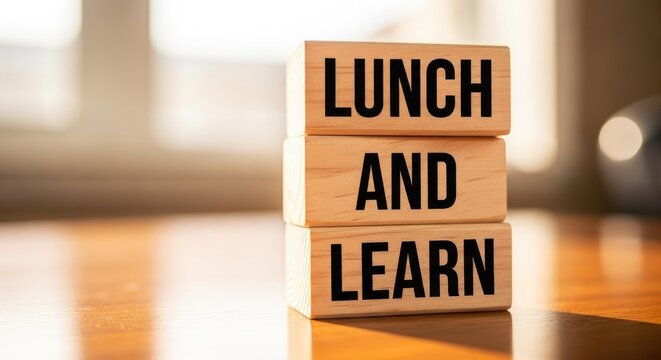 Engage employees with a Lunch and Learn training session using wooden blocks displaying the message, promoting professional development and boosting morale in the workplace