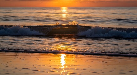 A serene sunset over the ocean with gentle waves reflecting the warm orange and yellow hues of the sky, creating a peaceful and calming seaside scene