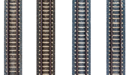 Detailed view of parallel train tracks leading to an unknown destination, symbolizing journey and progress.