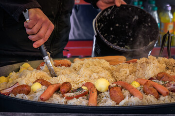 Choucroute garnie, sauerkraut with sausages, Christmas Market, Strasbourg France