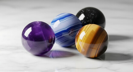 A collection of colorful polished gemstone spheres including amethyst, tiger's eye, and agate on a marble surface.