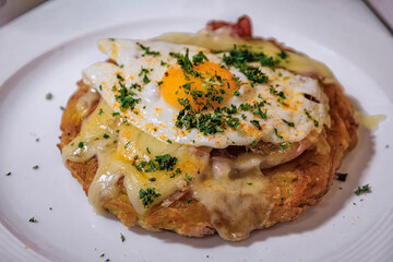 Crispy Bernese Rosti with ham cheese and egg, holiday meal in Zurich Switzerland