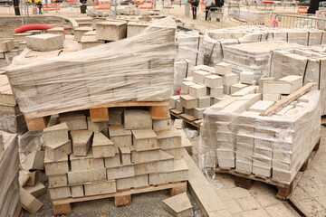 Construcion site of pavement granite cobblestone road in old city center installation or renovation repair.