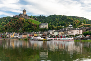 Fototapeta premium Stunning View of Castle Cochem and Picturesque Waterfront in Summer