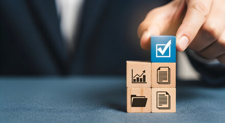 Hand placing a check mark block on wooden cubes business growth and success concept representing goals and achievement