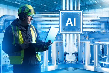 Industrial automation engineer configures AI-driven equipment using a laptop on the production...