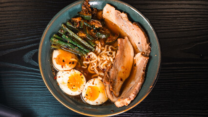 Delicious pork belly ramen with fresh asparagus, zucchini, and Nissin noodles. Rich broth, perfect comfort food. Quick and flavorful meal for Asian cuisine lovers.