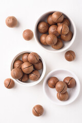 Fresh organic macadamia nuts on white background