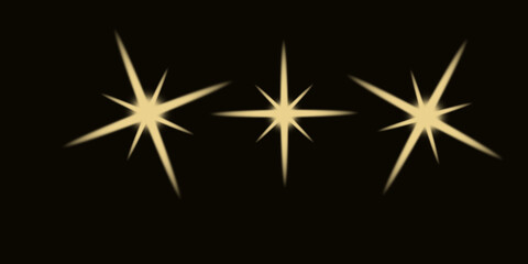 Three golden starbursts on a dark background