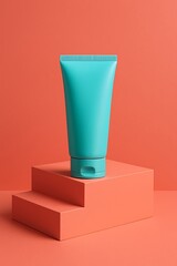 Vibrant aqua tube on coral geometric steps, stylish minimal product display perfect for beauty, skincare, and cosmetic branding visuals.
