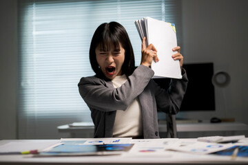 Businesswoman screaming from workload burnout and stress