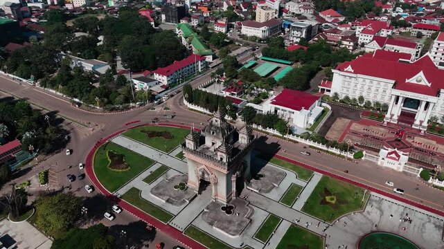 Cityscape's Embrace: An aerial panorama captures a vibrant cityscape, where grand architecture merges seamlessly with flourishing greenery, presenting a compelling tableau of urban life.