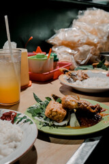 Indonesian Food Feast Rice, Fried Chicken, and Refreshing Drink