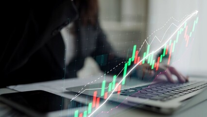 A business professional engages in financial analysis using a laptop, with a vibrant growth chart overlay illustrating market trends and development opportunities. Copula