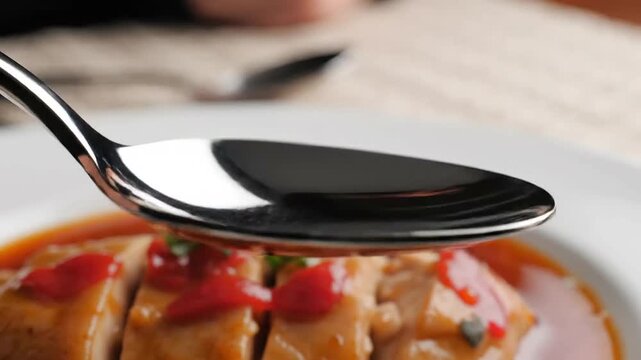 Tandoori chicken dish with spoon on plate indian food