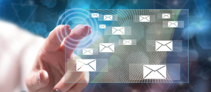Woman touching an email concept - Powered by Adobe