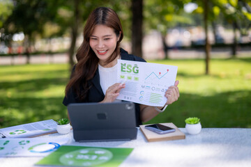 Woman presenting esg concept during an outdoor video call