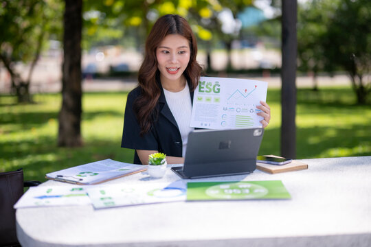 Businesswoman presenting esg report during outdoor video call