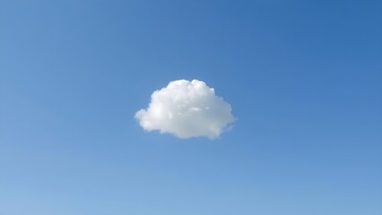 Single fluffy cloud in a vast blue sky, serene atmosphere.