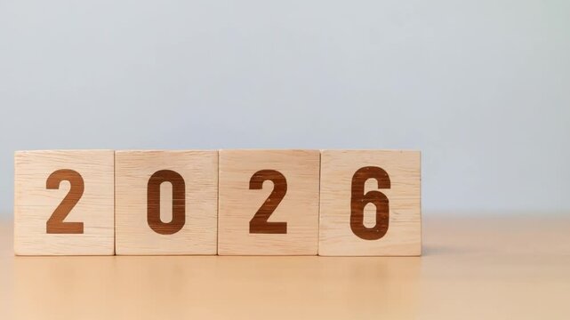 Flipping Wooden cube block for change 2025 to 2026, Countdown to 2026. Loading year.