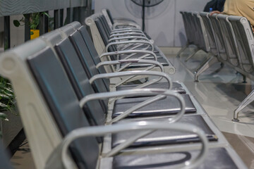 displays rows of waiting area chairs, typical of those found in public spaces like airports or train stations. 