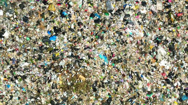 Overhead view of scattered waste showing the scale of pollution, environmental strain, overconsumption habits, ineffective waste management, and the importance of sustainability awareness.
