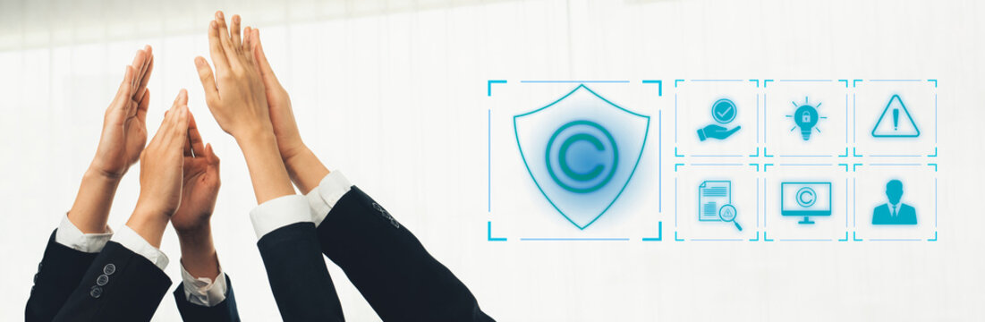 Diverse professionals join their hands in a collaborative gesture, emphasizing teamwork and the importance of protecting intellectual property in a modern business environment. Trope - Powered by Adobe