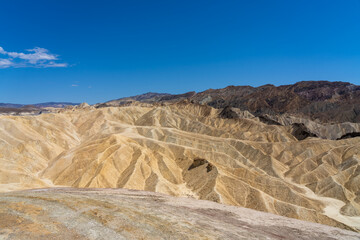 View of Zabriskie Point in Death Valley National Park in California, United States. Zabriskie Point is a part of the Amargosa Range located east of Death Valley noted for its erosional landscape.  © JHVEPhoto