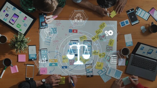 Creative team engages in collaborative design planning with mobile devices, sticky notes, and digital graphics. A vibrant workspace fosters innovative ideas and strategies. Raster