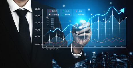 A business professional presents a digital screen displaying financial trends and growth metrics, highlighting modern analytics in a corporate setting. Scalp