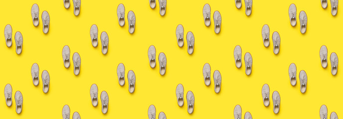 Casual male shoes on color background