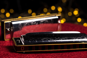 harmonica, on a blurred background with highlights. bokeh, close-up.